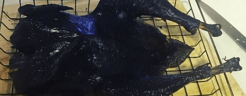 Blackened turkey on a wire rack.